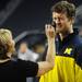 Michigan senior Zack Novak squints as a makeup artist applies some powder to his face before he goes on camera with teammate senior Stu Douglass during a taping of ESPN's College Game Day at Crisler Arena on Saturday morning. Melanie Maxwell I AnnArbor.com
